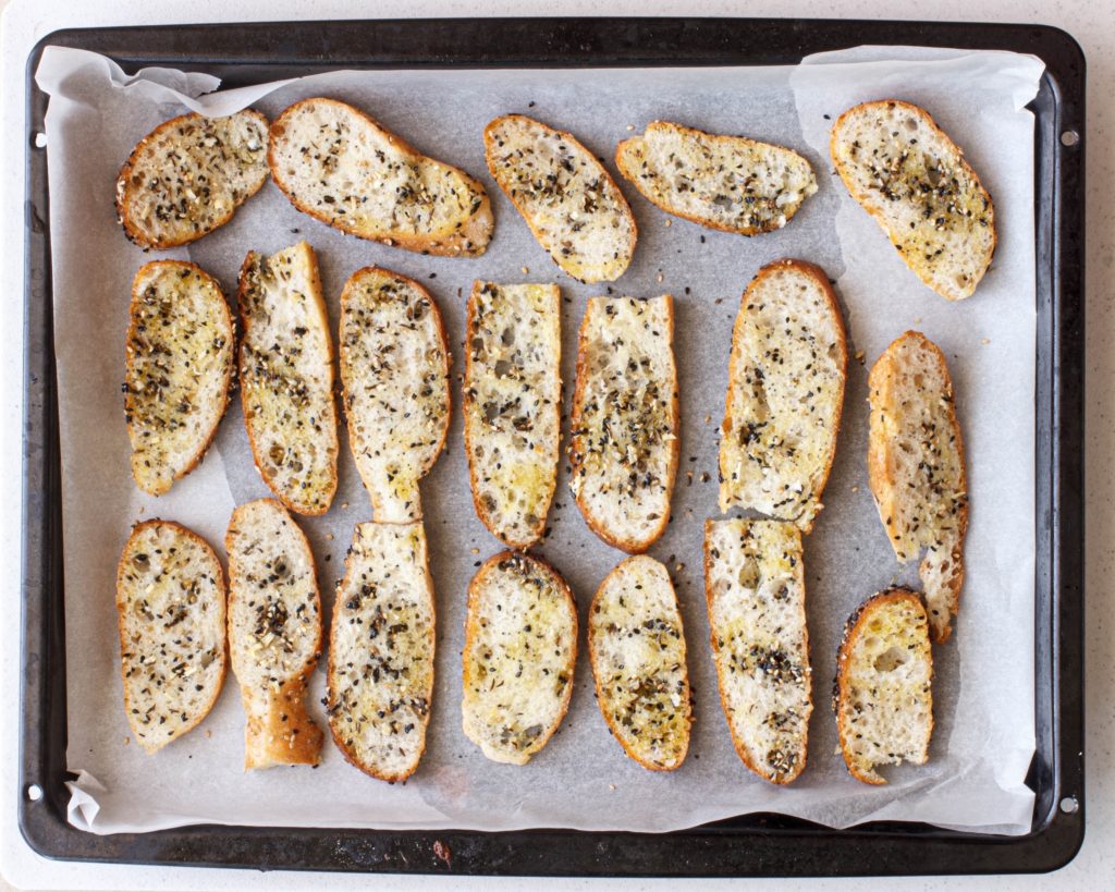 crostini toasts going into the oven